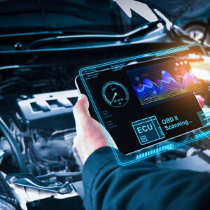 Auto mechanic checking ECU engine system with OBD2 wireless scan Auto mechanic checking ECU engine system with OBD2 wireless scanning tool and car information showing on screen interface,Car maintenance service concept.