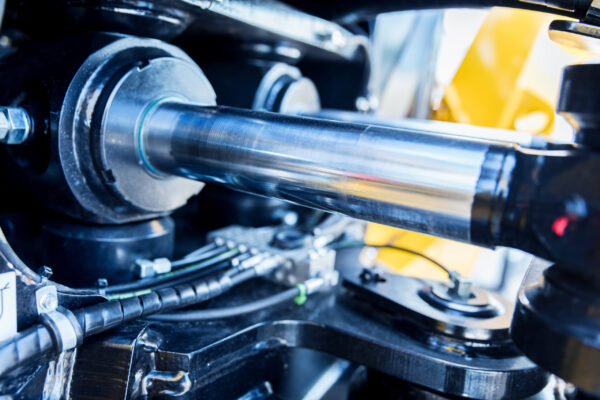 Steel mechanical parts Steel mechanical parts and cylinder still industrial close-up. Blue-toned.